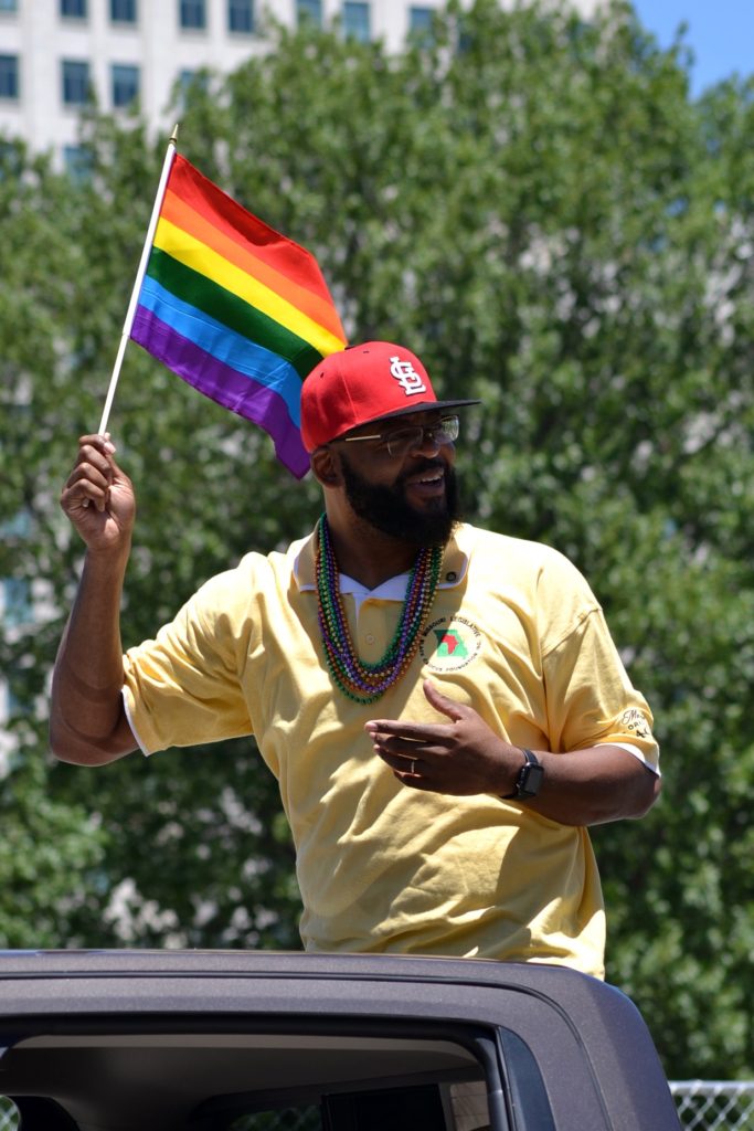 St. Louis Pride Parade Local Politician with rainbow flag