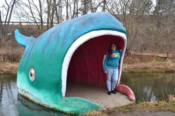 Carly standing inside Willy The Whale