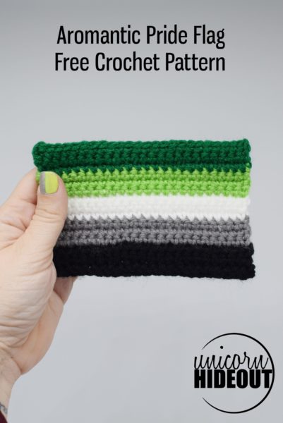 hand holding a crochet aromantic pride flag, words on image: "Aromantic Pride Flag Free Crochet Pattern, Unicorn Hideout"