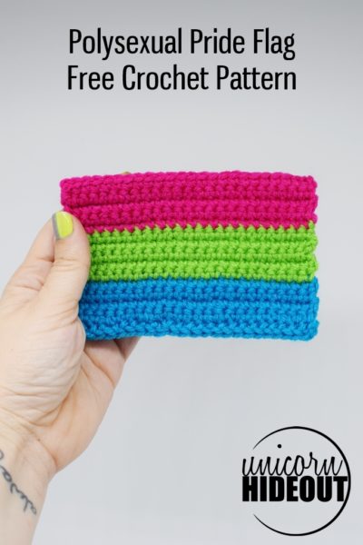 Hand holding Crochet polysexual pride flag on a white background, words on image: "Polysexual Pride Flag, Free Crochet Pattern, Unicorn Hideout"