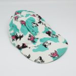 White and mint green cow print ball cap with horses on it