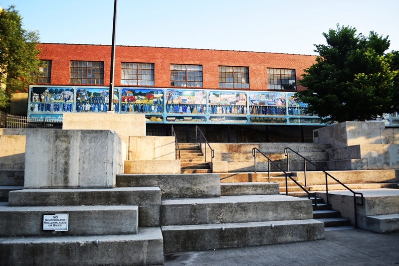 Large mural sits above concrete stair structures